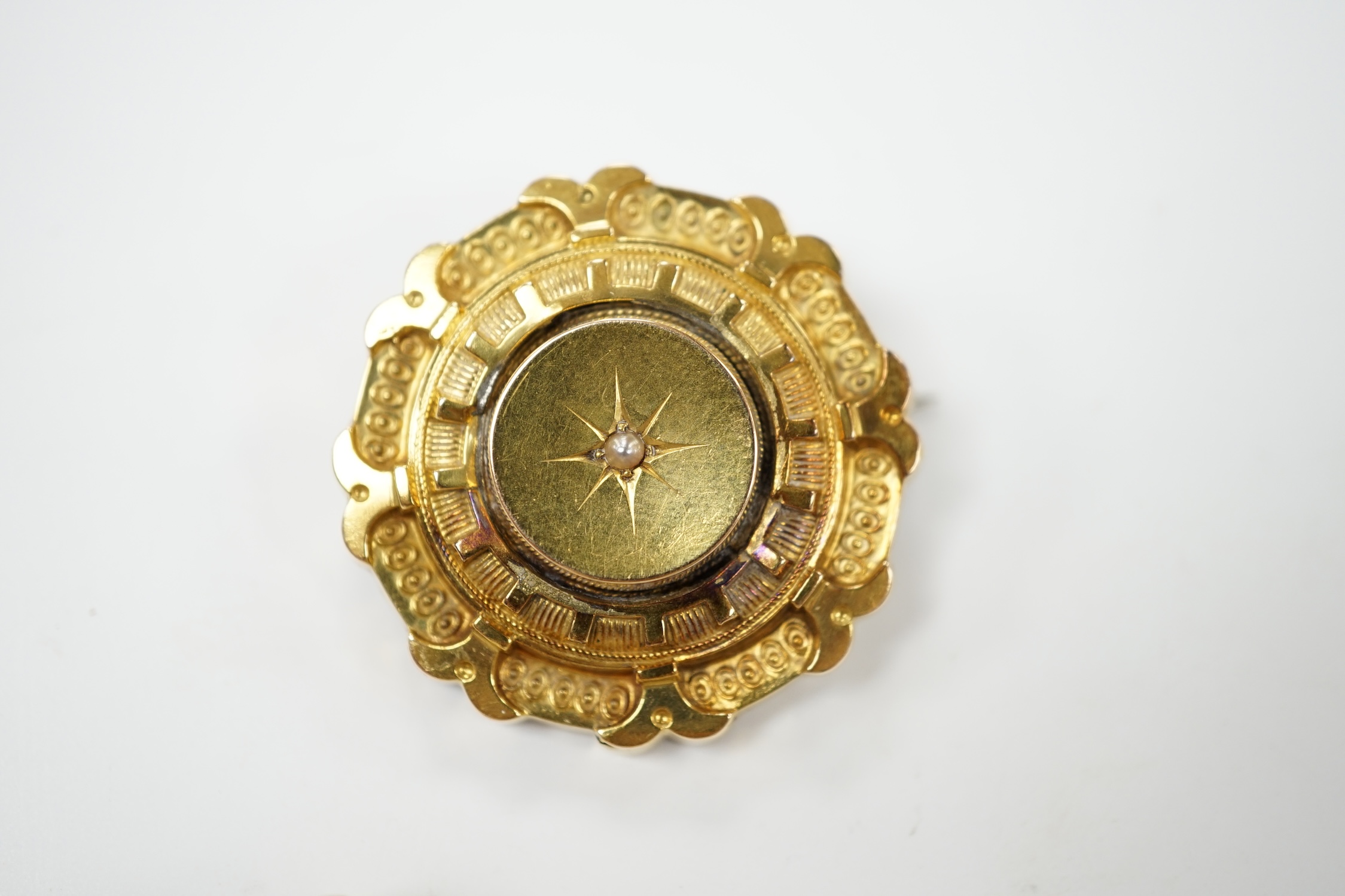 A late Victorian 15ct gold and split pearl set circular brooch, 34mm, gross weight 7.7 grams, together with a yellow metal and diamond chip set bar brooch, gross weight 2.6 grams. Condition - fair